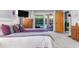 Spacious bedroom with pool view, king-size bed, and wooden dresser at 3014 Guadalupe Dr, Punta Gorda, FL 33950