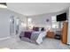 Main bedroom with a double bed, dresser and ensuite bathroom access at 3014 Guadalupe Dr, Punta Gorda, FL 33950