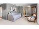 Bedroom with daybed, accent chair, and access to laundry area at 3014 Guadalupe Dr, Punta Gorda, FL 33950