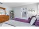 Bedroom with king bed, built-in shelving, and ensuite bathroom access at 3014 Guadalupe Dr, Punta Gorda, FL 33950