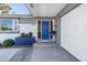 Inviting front door with a blue door and landscaping at 3014 Guadalupe Dr, Punta Gorda, FL 33950