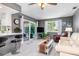 Living room with comfy furniture, TV, and access to the pool area at 3014 Guadalupe Dr, Punta Gorda, FL 33950