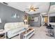 Living room featuring a white couch, coffee table, and a gray wall at 3014 Guadalupe Dr, Punta Gorda, FL 33950