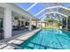 Sparkling pool with screened enclosure and patio access at 3014 Guadalupe Dr, Punta Gorda, FL 33950