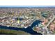 Wide aerial showcasing the home's waterfront location in a community at 3936 Crooked Island Dr, Punta Gorda, FL 33950