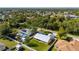 Aerial view of a house with a pool and spacious backyard at 86 Zenith St, Port Charlotte, FL 33954