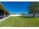 Large grassy backyard with privacy fence at 86 Zenith St, Port Charlotte, FL 33954