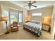 Spacious bedroom with king-size bed and bay window at 10900 Lerwick Cir, Englewood, FL 34223