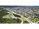 Aerial view of home near park and water at 112 Sunnyside Nw St, Port Charlotte, FL 33952