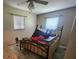 Bedroom with a double bed, and wood flooring at 112 Sunnyside Nw St, Port Charlotte, FL 33952