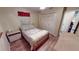 Bedroom with a double bed, built-in wardrobe, and wood flooring at 112 Sunnyside Nw St, Port Charlotte, FL 33952
