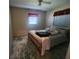 Bedroom with a double bed and wood flooring at 112 Sunnyside Nw St, Port Charlotte, FL 33952