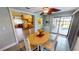 Bright dining area with pool view and wood table at 112 Sunnyside Nw St, Port Charlotte, FL 33952