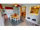 Dining area with wood table and pool access at 112 Sunnyside Nw St, Port Charlotte, FL 33952