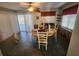 Dining area with wood table and pool access at 112 Sunnyside Nw St, Port Charlotte, FL 33952