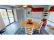 Dining area with pool view and wood table at 112 Sunnyside Nw St, Port Charlotte, FL 33952