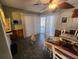 Dining area with wood table and pool view at 112 Sunnyside Nw St, Port Charlotte, FL 33952