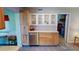 Kitchen boasts stainless steel dishwasher and ample wood cabinets at 112 Sunnyside Nw St, Port Charlotte, FL 33952