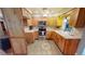 Bright kitchen with stainless steel appliances and wood cabinets at 112 Sunnyside Nw St, Port Charlotte, FL 33952