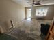Living room with hardwood floors and ceiling fan, currently under renovation at 112 Sunnyside Nw St, Port Charlotte, FL 33952