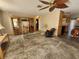 Living room with hardwood floors and ceiling fan, currently under renovation at 112 Sunnyside Nw St, Port Charlotte, FL 33952