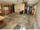 Living room with hardwood floors and ceiling fan, currently under renovation at 112 Sunnyside Nw St, Port Charlotte, FL 33952