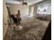 Living room with hardwood floors and ceiling fan, currently under renovation at 112 Sunnyside Nw St, Port Charlotte, FL 33952