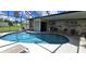 Relaxing screened pool and patio area, perfect for outdoor enjoyment at 112 Sunnyside Nw St, Port Charlotte, FL 33952