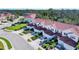 Community of townhomes with red tile roofs and landscaped yards at 1191 Jonah Dr, North Port, FL 34289