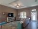 Living room with cozy seating, large TV, and access to other rooms at 1285 Liggett Cir, Port Charlotte, FL 33953