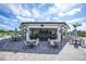 Outdoor community clubhouse with seating at 15023 Black Cherry Way, Punta Gorda, FL 33955