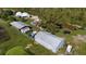 Aerial view of property, including outbuildings and domes at 15871 Huffmaster Rd, North Fort Myers, FL 33917