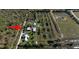 Aerial view of property with home and large lot at 15871 Huffmaster Rd, North Fort Myers, FL 33917