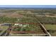 Aerial view of property with home and large lot at 15871 Huffmaster Rd, North Fort Myers, FL 33917
