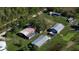 Aerial view of property with multiple outbuildings at 15871 Huffmaster Rd, North Fort Myers, FL 33917