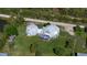 Aerial view of dome house and surrounding land at 15871 Huffmaster Rd, North Fort Myers, FL 33917