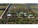 Aerial view of property showing home and acreage at 15871 Huffmaster Rd, North Fort Myers, FL 33917