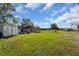 Image shows various animal enclosures in a grassy area at 15871 Huffmaster Rd, North Fort Myers, FL 33917