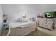 Spacious bedroom with a large bed and a dresser at 15871 Huffmaster Rd, North Fort Myers, FL 33917