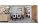 Dining area with table and chairs, kitchen view at 15871 Huffmaster Rd, North Fort Myers, FL 33917