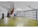 Spacious garage with overhead door and storage at 15871 Huffmaster Rd, North Fort Myers, FL 33917