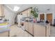 Kitchen features light wood cabinets and a large island at 15871 Huffmaster Rd, North Fort Myers, FL 33917