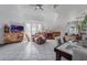 Open living room and dining area with tiled floors at 15871 Huffmaster Rd, North Fort Myers, FL 33917