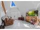 Bright living room with a comfy couch and large TV at 15871 Huffmaster Rd, North Fort Myers, FL 33917