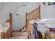 Wooden staircase leading to upper level at 15871 Huffmaster Rd, North Fort Myers, FL 33917