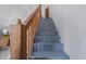 Wooden staircase leading to the upper level at 15871 Huffmaster Rd, North Fort Myers, FL 33917