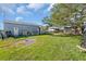 Gray storage shed and other outbuildings in backyard at 15871 Huffmaster Rd, North Fort Myers, FL 33917