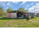 Covered workshop with various equipment at 15871 Huffmaster Rd, North Fort Myers, FL 33917