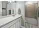 Modern bathroom with a white vanity and a tub shower combo at 16224 Laurel Oak Ln, Punta Gorda, FL 33982