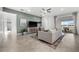 Living room with green accent wall, access to patio, and natural light at 16224 Laurel Oak Ln, Punta Gorda, FL 33982